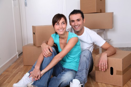 Professional movers loading furniture during a Chelsfield relocation