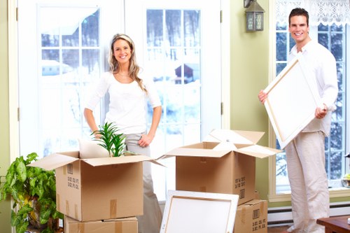 Domestic moving team handling furniture during Chelsfield removals